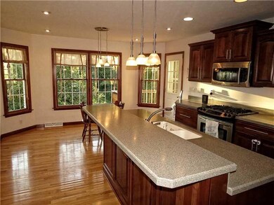 Kitchen. The kitchen enjoys many gathering areas i