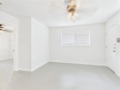 Unfurnished room with concrete floors and ceiling
