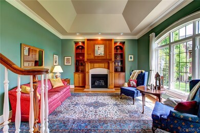Formal living room with hardwood floors, vaulted c