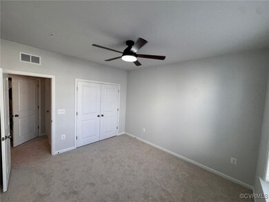 Unfurnished bedroom featuring ceiling fan, light c