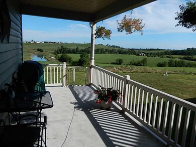 Facade/Exterior Front. Relax on the covered porch 