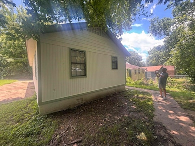View of property exterior with crawl space