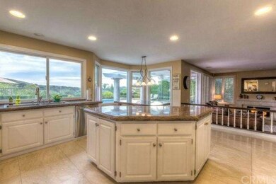 Kitchen has fantastic views! Prep island, all gran