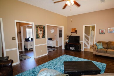 Open plan from great room into the dining rm and k