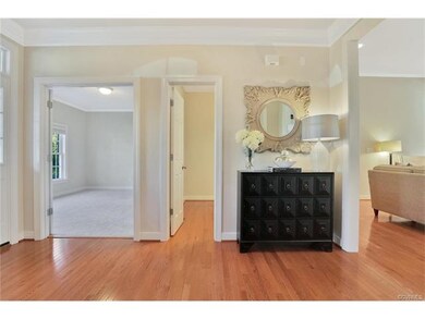 Foyer - 6 x 14, hardwood floor, light fixture, multiple-member crown moulding