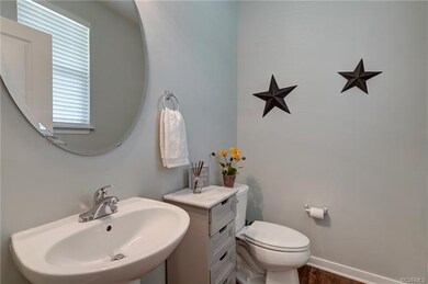 Nicely appointed Powder Room is conveniently located off the Foyer.