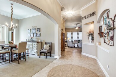 Expansive! Welcoming you with height of ceiling, arches, molding, niches.