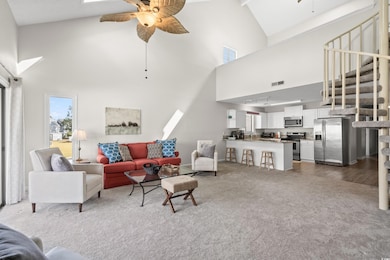 Living room with dark hardwood / wood-style floors