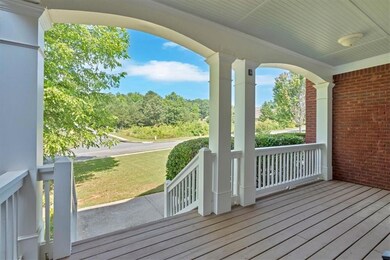 Porch featuring a yard