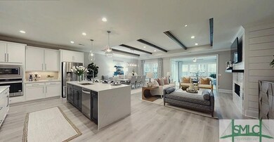 View of gourmet kitchen and great room from foyer