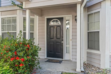 Entrance to property featuring a porch