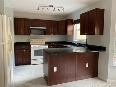 Kitchen area with barstool area