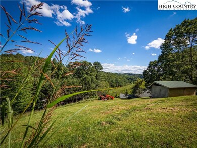 Multiple building opportunities await, including an upper-pasture site with stunning long-range views near the chicken coop.