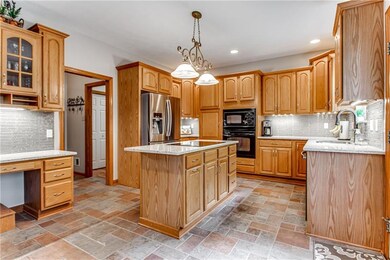 This is an enormous kitchen! Quartz countertops, an abundance of cabinetry with pull out drawers. All appliances are included. Beyond the kitchen sits the 1st floor laundry. Front loader washer & dryer also included.