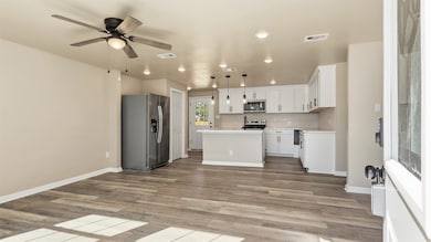 Welcome inside! This home features brand new LVP flooring throughout and recessed lighting in the open-concept living and kitchen area. Enjoy new appliances backed by a limited lifetime warranty.