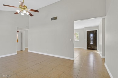Unfurnished room featuring light tile patterned fl