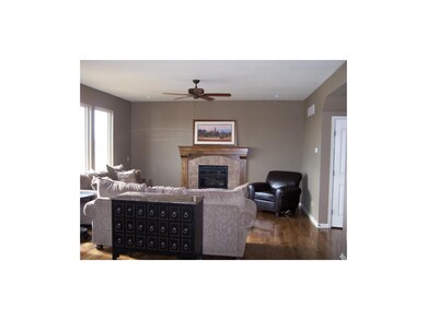 Large great room with hardwoods, open to kitchen