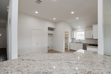 Island looking into kitchen with new LED lighting