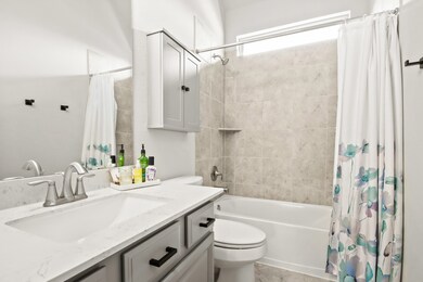 Secondary Bathroom conveniently located between both secondary bedrooms and office.
