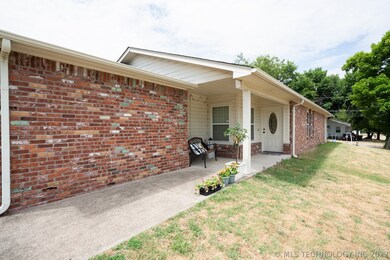 Wide sidewalk between driveway and front porch mak