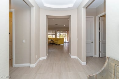 Welcoming entry featuring light tile patterned flo