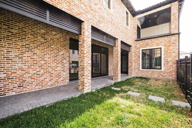 Gated side yard with covered patio