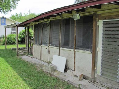 Exterior Back. ENCLOSED PORCH.