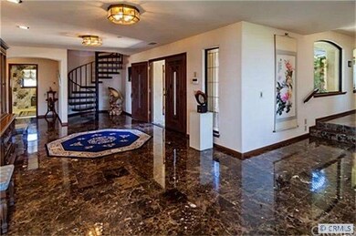 Gorgeous flooring welcomes you into this gracious 