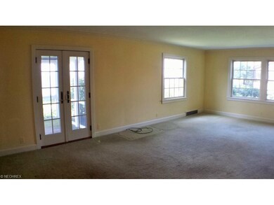 Huge living room. French doors lead to a great scr