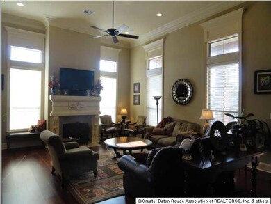 Living area with heart pine floors, 14'ceilings, w