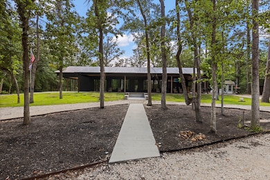 A long gravel path leads to the striking front ele