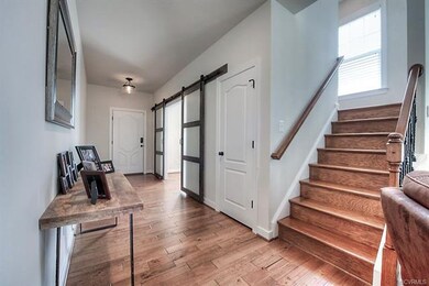Hardwood staircase with wrought iron spindles tuck