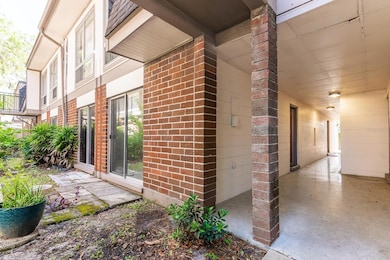 Entrance on right and sliding glass doors on left.