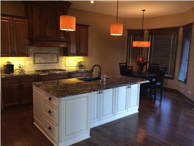 Oversized island with cabinets and drawers built i