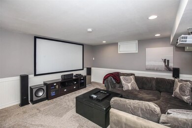 Great room in lower level 100in HD theater project