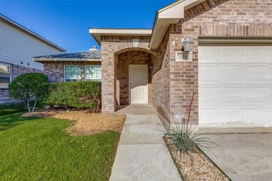 View of exterior entry with a lawn