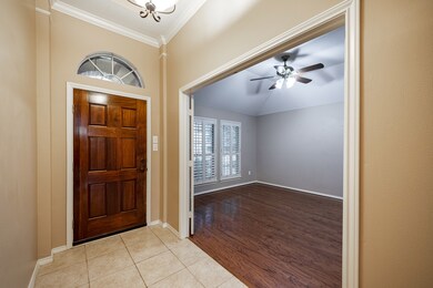 Entry way and a view into the large study/library with French doors.