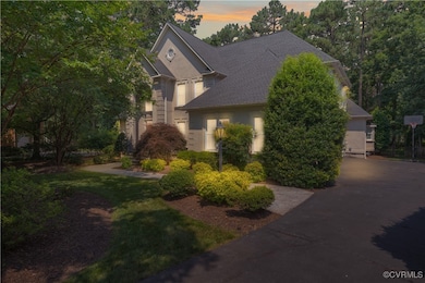 View of front of home featuring a shingled roof