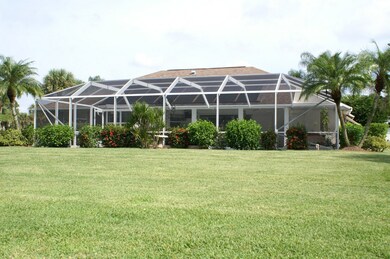 View of large pool and patio screen enclosure.