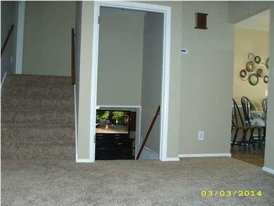 Stairs lead up to bedrooms or down to family room 