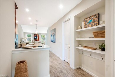 Kitchen with light countertops, light wood-style flooring, a peninsula, pendant lighting, and recessed lighting