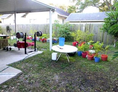 Exterior Back - Covered patio and fenced in back yard.