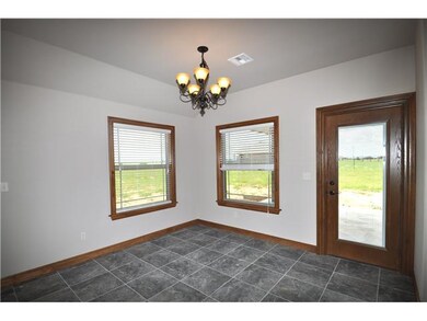 Dining Room. Dining area has glass insert wooden d