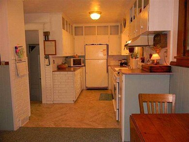 Kitchen. Large windows in kitchen brighten daytime