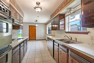 Kitchen and breakfast area with ceramic tile floor