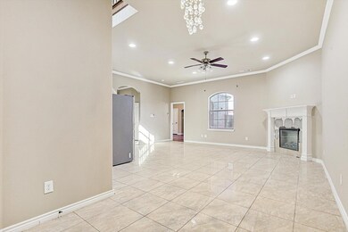 Unfurnished living room with ceiling fan, a firepl