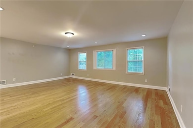 Spare room featuring light wood-type flooring and recessed lighting