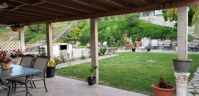 looking out family room sliding doors onto covered