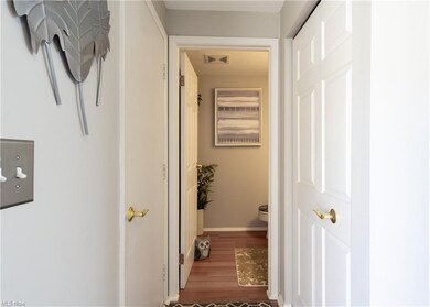 1/2 bath off of foyer, coat closet, and door to ga