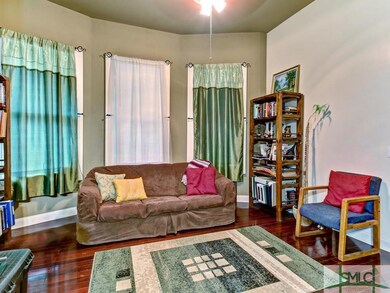 Apartment A: living room with hardwood floor, ceil